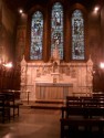 The Lady Chapel was designed as part of the original church complex and was finished in 1895.  Originally it looked remarkably more like the current main church interior - each having a striking resemblence to Sainte-Chapelle in Paris.  The original polychromed decorations of the Lady Chapel, however, were almost immediately replaced with stained glass windows and a series of paintings by Elliott Dangerfield covering all of the walls.